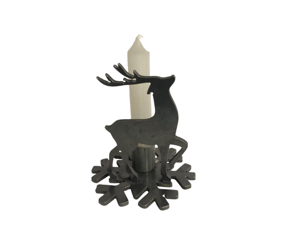 Decorative candle holder shaped like a reindeer on a white background