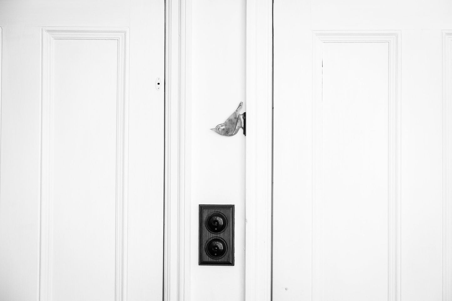 Home Decor steel Nuthatch bird attached to the side of a door frame