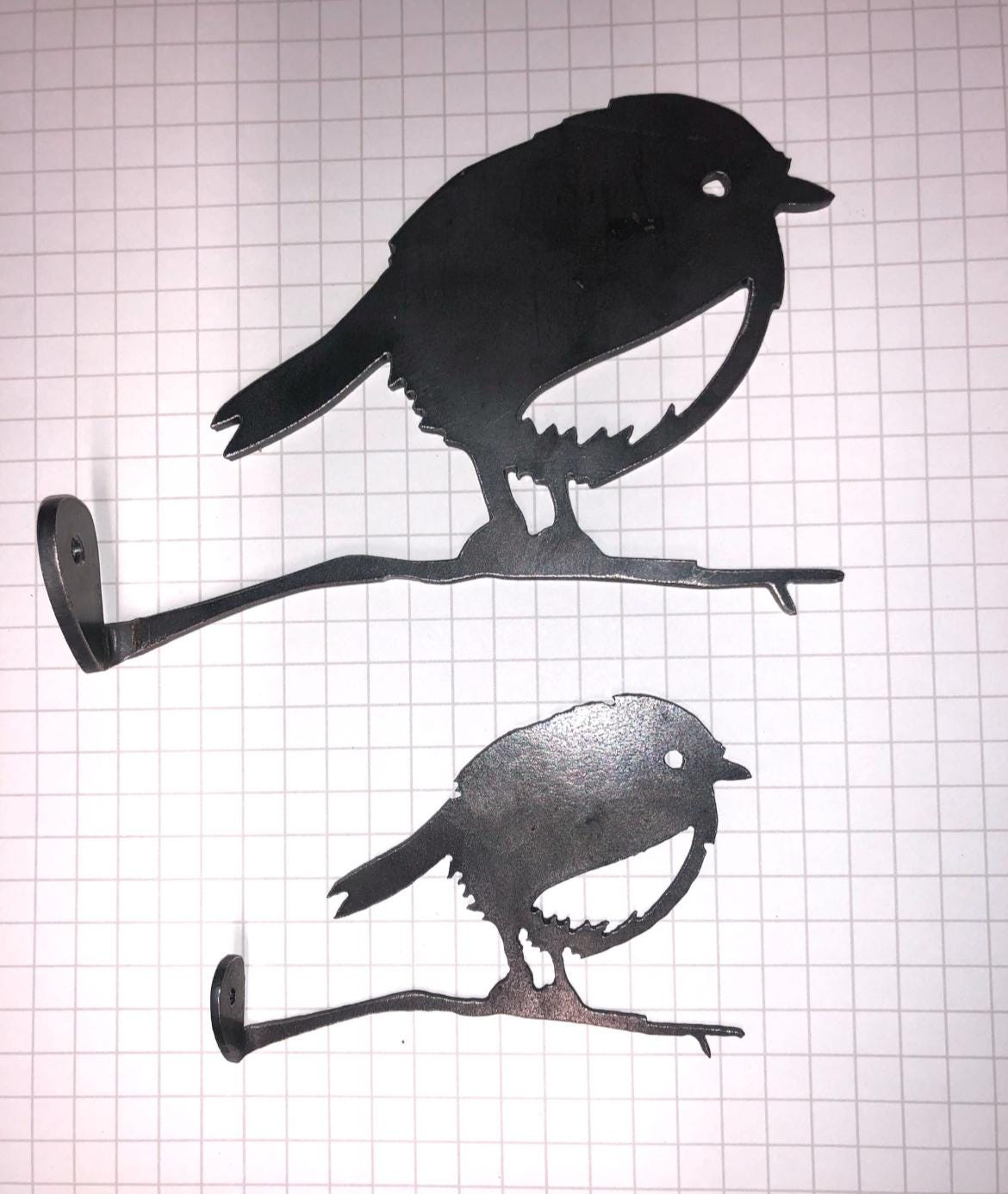 Steel Robin on a branch garden decoration, in a small or a large