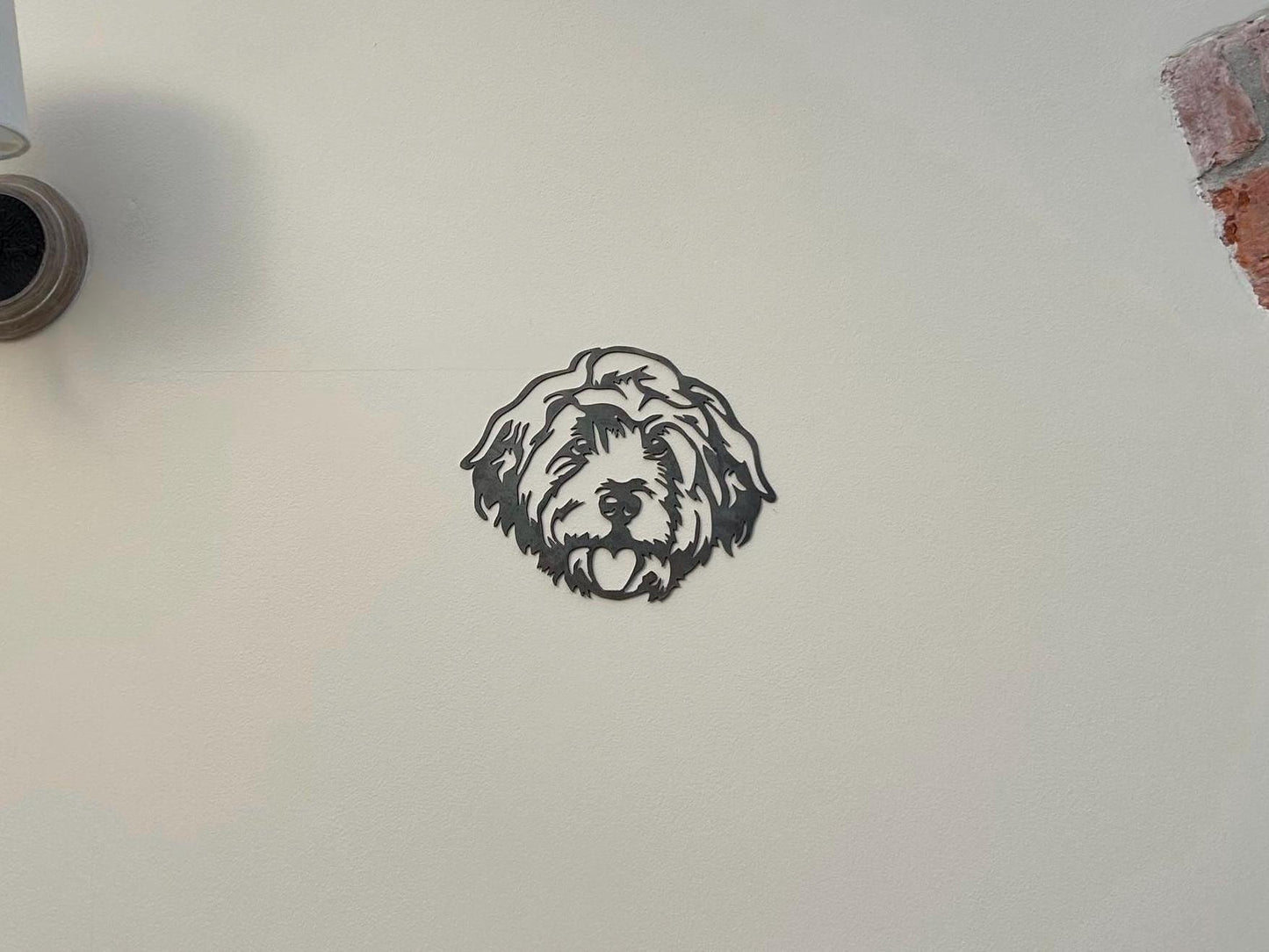 Metal cockapoo head on display in a home