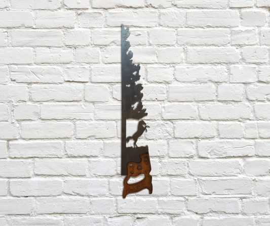 Decorative vintage saw with rearing horse on a white brick wall.